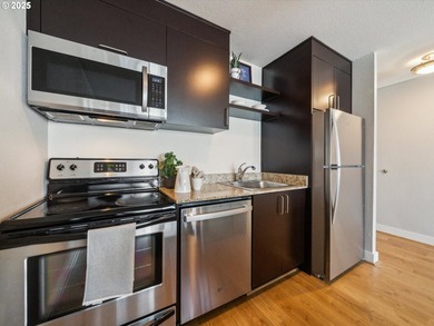 Meticulously maintained condo at Harrison West. Unit 9C is a