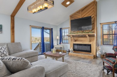 This charming two-story lake home offers stunning views and 1 - photo 11