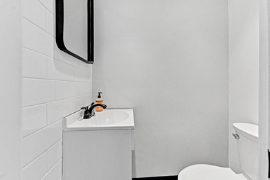 Stylishly updated 2-bedroom, 1.5-bathroom corner unit in the - photo 12