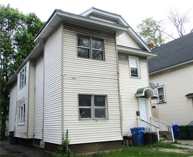 This vinyl-sided multi-family home has two 3-bedroom units. Each - photo 1