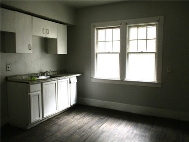 This vinyl-sided multi-family home has two 3-bedroom units. Each - photo 4