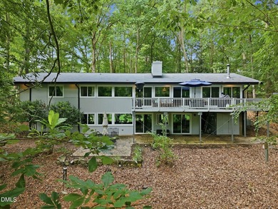 Set on two lots totaling 1.3 acres with panoramic views of the - photo 1