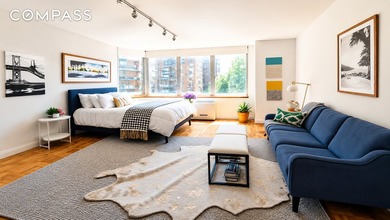Welcome to Unit 28D, a bright and efficiently designed studio - photo 1