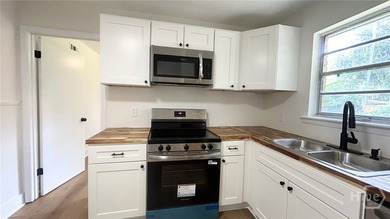 Looking for your first home? This beautifully updated solid - photo 11