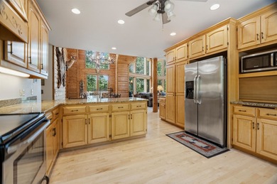 Custom built and thoughtfully designed, this stunning log home - photo 19