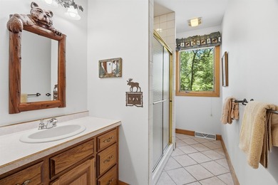 Custom built and thoughtfully designed, this stunning log home - photo 23