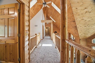Custom built and thoughtfully designed, this stunning log home - photo 27