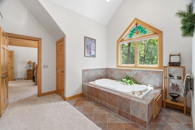 Custom built and thoughtfully designed, this stunning log home - photo 35