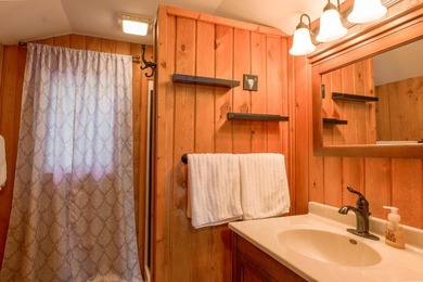 This one has a Northwoods personality with classic rustic charm - photo 17