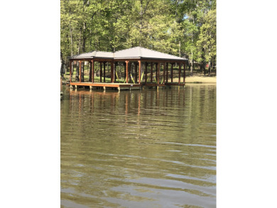 0.64 acre Waterfront Lot with 2-slip boathouse in gated community - Lake Lot For Sale in Yantis, Texas