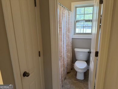 Beautifully positioned on the golf course, this four-sided brick - photo 33