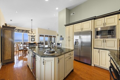 This spectacular 5 bedroom, 4 full bath, 2nd floor beachfront