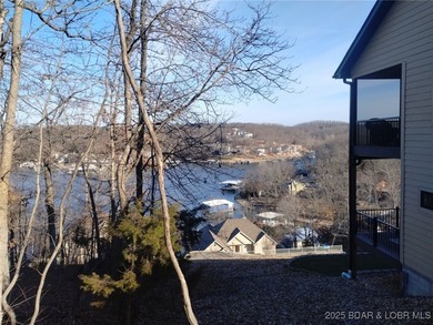 Check out this hard-to-find available lake view building site in - photo 2