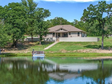 A serene lakefront retreat in private Tuscany Lake Estates, this - photo 3