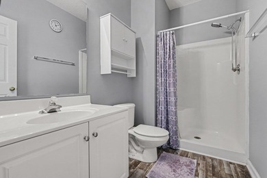 This updated second-floor, 3-bedroom, 2-bath condo overlooks the - photo 13
