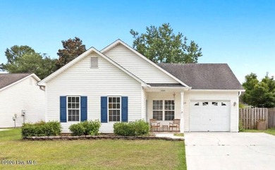 Welcome to this well-maintained 3-bedroom, 2-bath home in the - photo 1