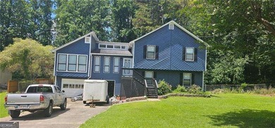 A charming, raised ranch in the heart of Acworth! Three-bedroom - photo 1