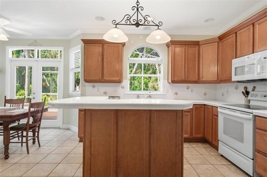 Tucked beneath a canopy of mature trees in the gated community - photo 15