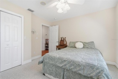 Tucked beneath a canopy of mature trees in the gated community - photo 31