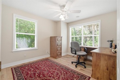 Tucked beneath a canopy of mature trees in the gated community - photo 33