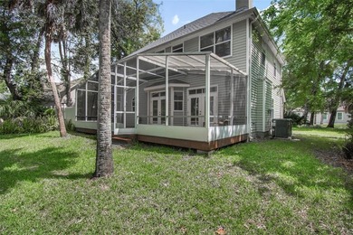 Tucked beneath a canopy of mature trees in the gated community - photo 41