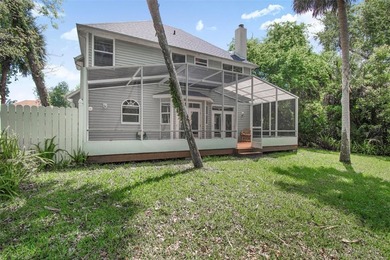 Tucked beneath a canopy of mature trees in the gated community - photo 42