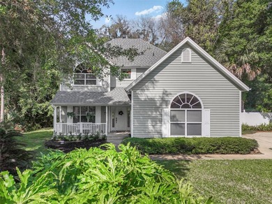 Tucked beneath a canopy of mature trees in the gated community - photo 43