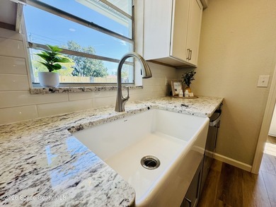 Welcome home. This thoughtfully renovated block pool home rests - photo 8