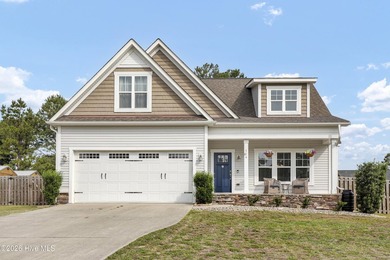 Welcome to this charming coastal cottage situated on almost a - photo 3
