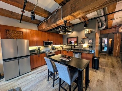 This beautifully maintained, open-concept condo/loft at River - photo 3