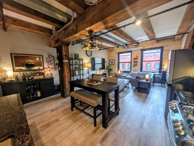 This beautifully maintained, open-concept condo/loft at River - photo 7