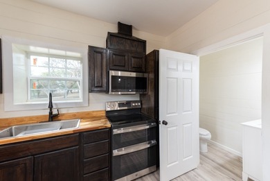 HUGE $75,000 REDUCTION!!! DISCOVER THE ULTIMATE SETUP FOR LIVING - photo 12