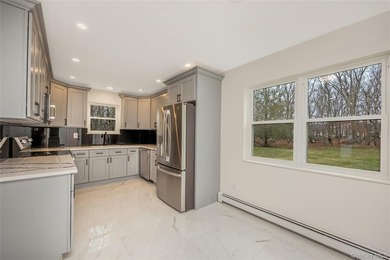Welcome to this beautifully renovated 4-bedroom, 2.5-bath home - photo 8