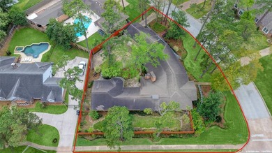 Tucked beneath towering mature trees, this sprawling ranch home - photo 1