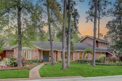 Tucked beneath towering mature trees, this sprawling ranch home - photo 6