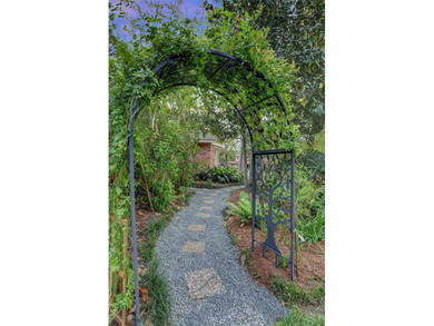 Tucked beneath towering mature trees, this sprawling ranch home - photo 7