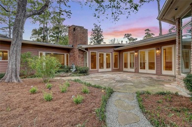 Tucked beneath towering mature trees, this sprawling ranch home - photo 9