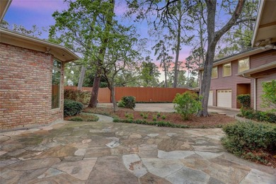 Tucked beneath towering mature trees, this sprawling ranch home - photo 10
