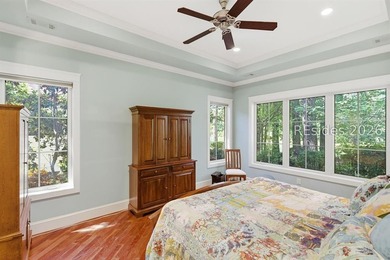 Tucked into a serene waterfront setting where towering trees - photo 25