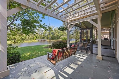 Tucked into a serene waterfront setting where towering trees - photo 43