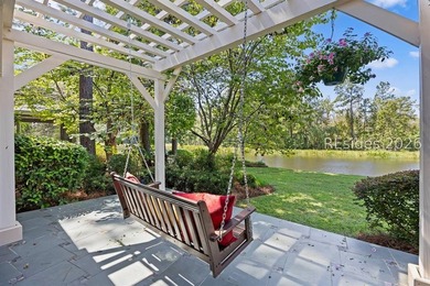Tucked into a serene waterfront setting where towering trees - photo 44