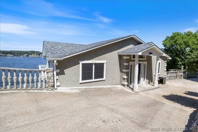 Perched above the shimmering waters of the Lake of the Ozarks - photo 11
