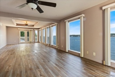 Perched above the shimmering waters of the Lake of the Ozarks - photo 22