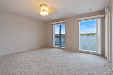 Perched above the shimmering waters of the Lake of the Ozarks - photo 34