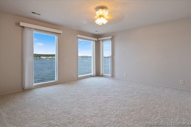 Perched above the shimmering waters of the Lake of the Ozarks - photo 35