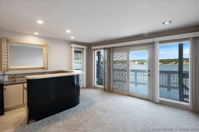 Perched above the shimmering waters of the Lake of the Ozarks - photo 36