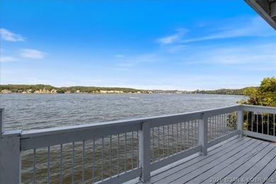 Perched above the shimmering waters of the Lake of the Ozarks - photo 40