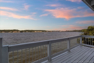 Perched above the shimmering waters of the Lake of the Ozarks - photo 41