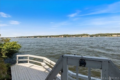 Perched above the shimmering waters of the Lake of the Ozarks - photo 44