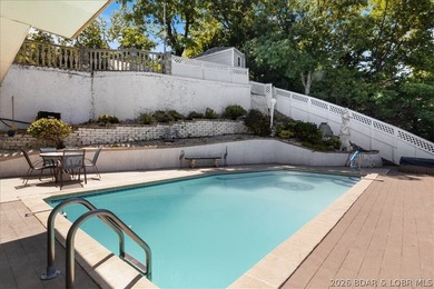 Perched above the shimmering waters of the Lake of the Ozarks - photo 45